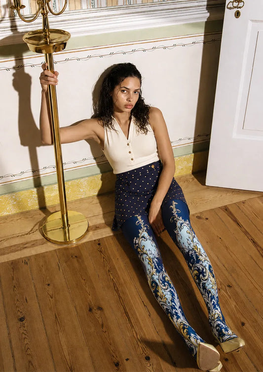 Model wearing Navy Gold Baroque Scroll Tights in a styled outfit