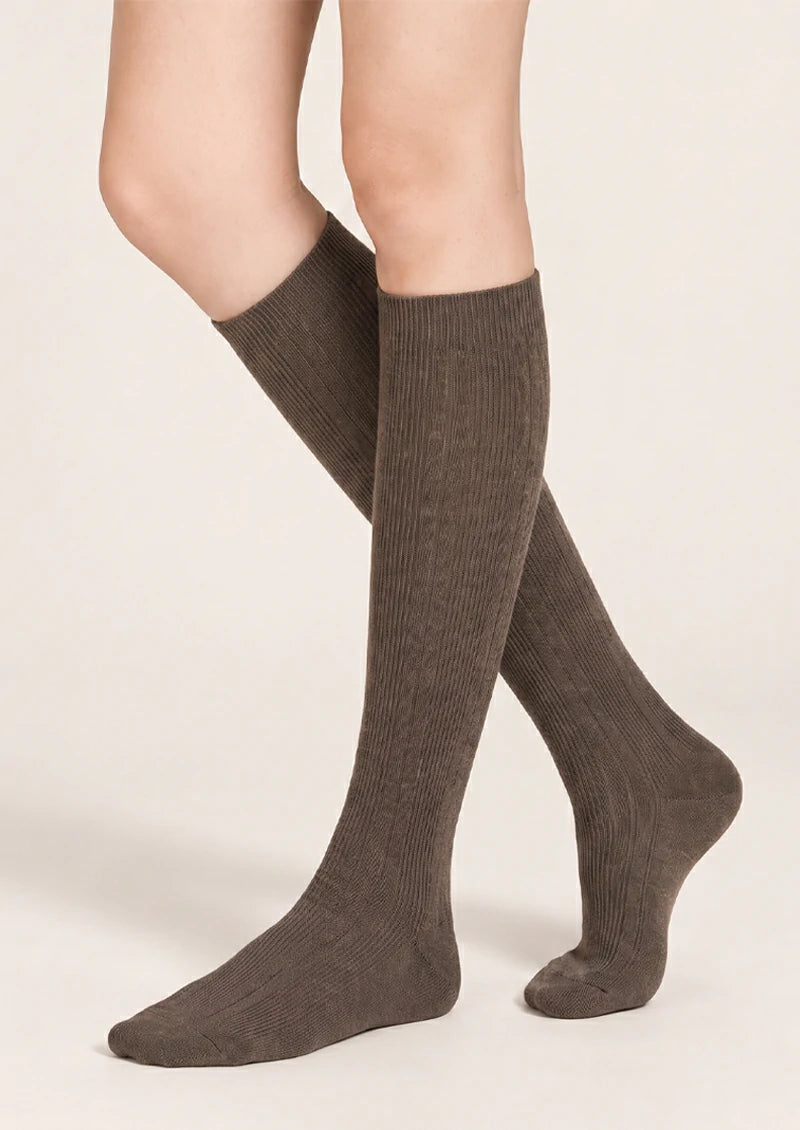 Solid ribbed knee-high socks in Brown, Gray, Black, Ivory, and Beige color options.