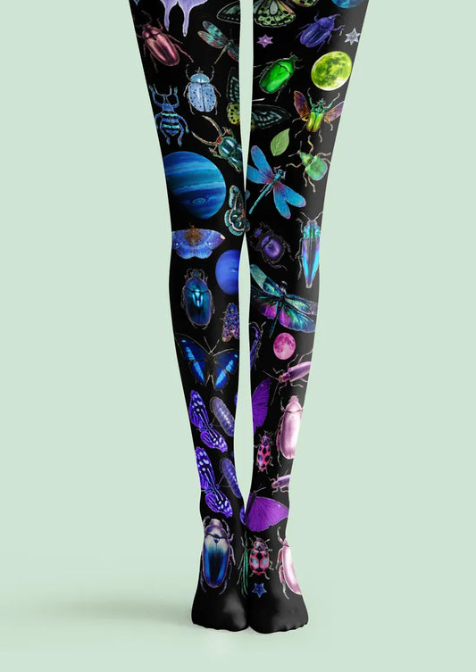 Black printed tights with colorful insects, planets, moons, and celestial details