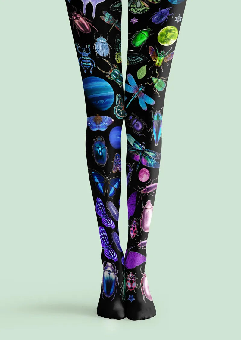 Black printed tights with colorful insects, planets, moons, and celestial details