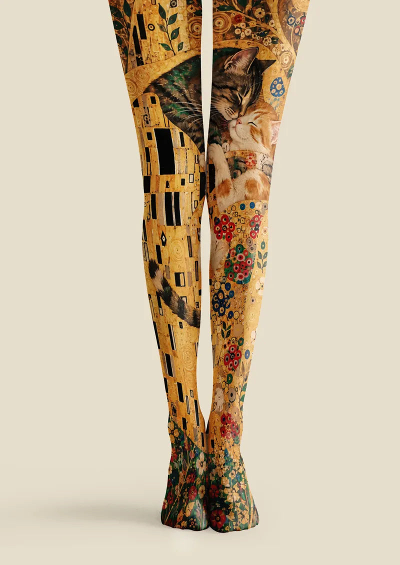 Yellow printed tights with cuddling cats, floral accents, and gold decorative artwork
