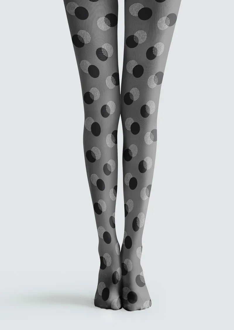 Gray printed tights with overlapping black and white polka dots in solid and dotted circular designs
