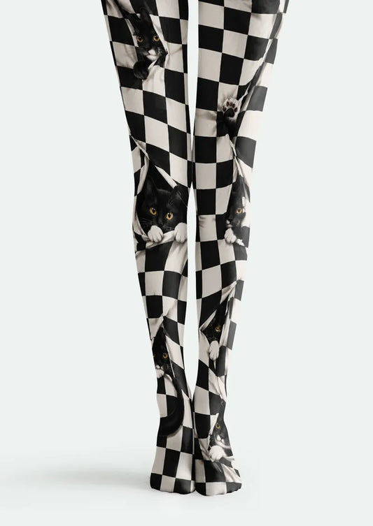 Black and white printed tights with checkerboard pattern and playful black cat portraits