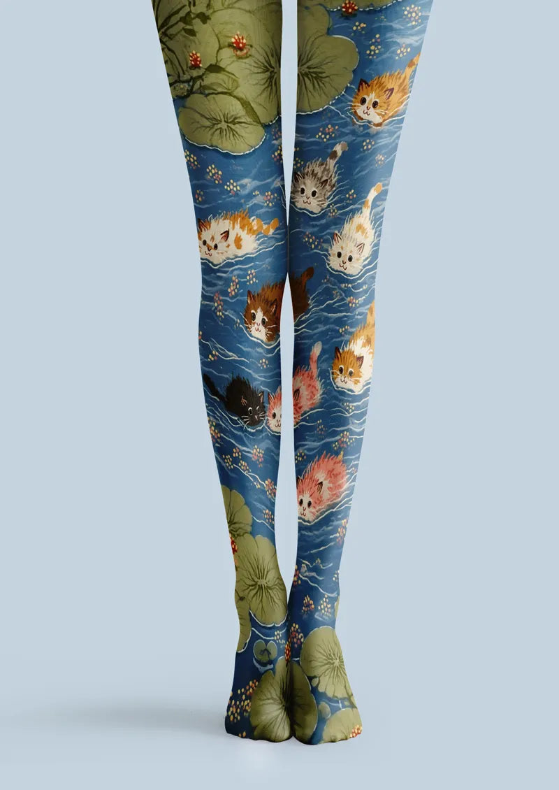 Blue printed tights with swimming kittens, lily pads, and small floral pond details