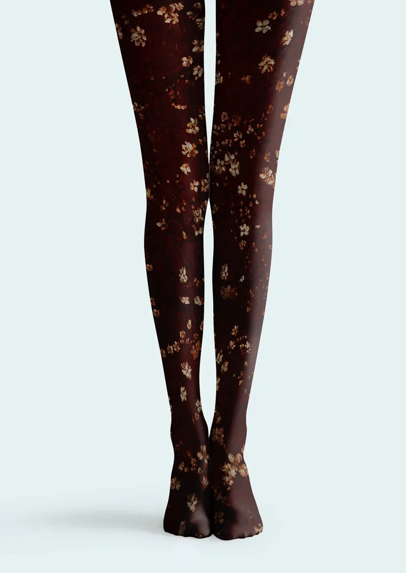 Burgundy printed tights with scattered small floral motifs in cream tones