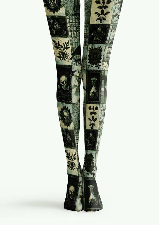 Green printed tights with skull panels, botanical motifs, birds, and gothic object details
