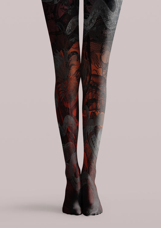 Black printed tights with coiling snakes, illustrated faces, insect details, and dark gothic collage artwork