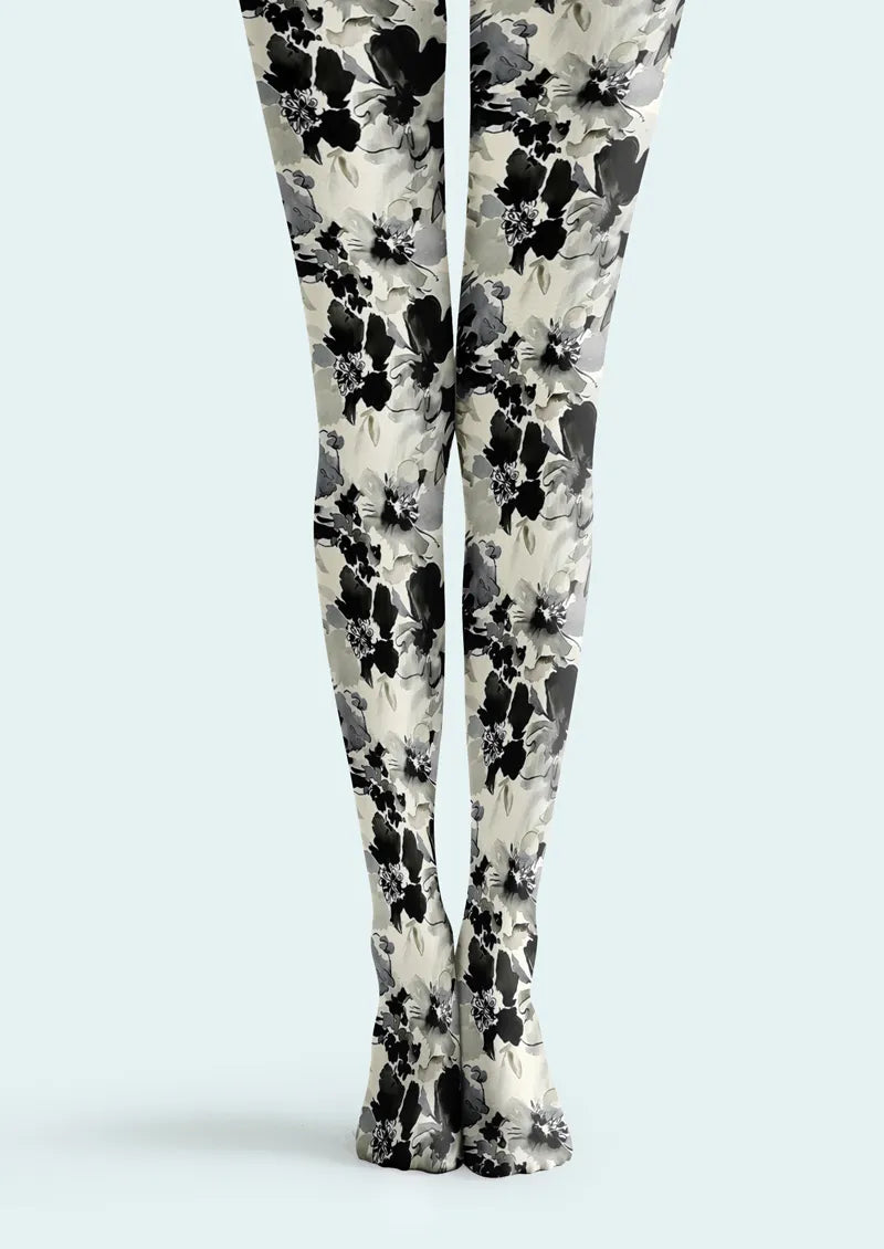 Light-toned printed tights with black and gray watercolor floral motifs