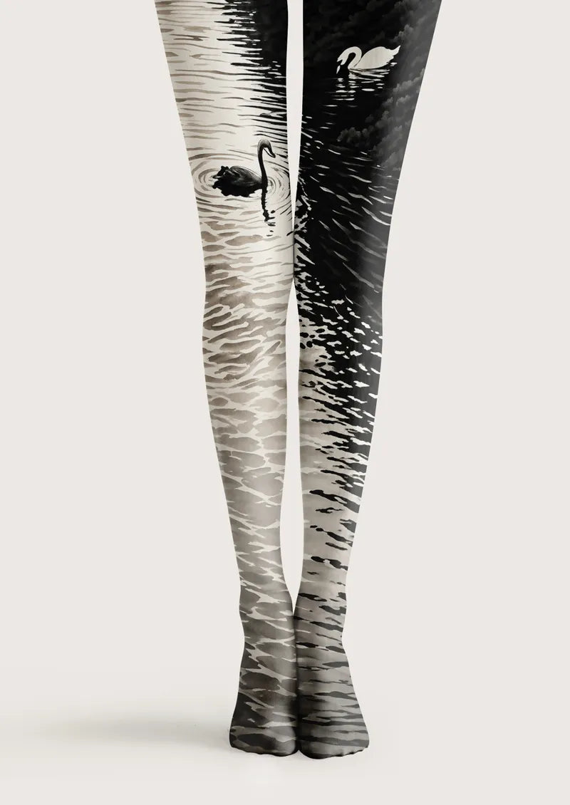 Black and white printed tights with contrasting swans and layered water ripple motifs