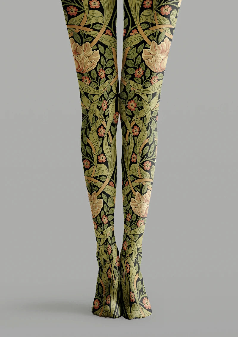 Green and black printed tights with sweeping leaves, large beige blooms, small orange flowers and crossing curved stems.