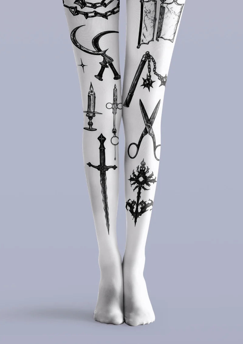 White printed tights with black tattoo-style blades, scissors, chains, candle and ornamental symbols