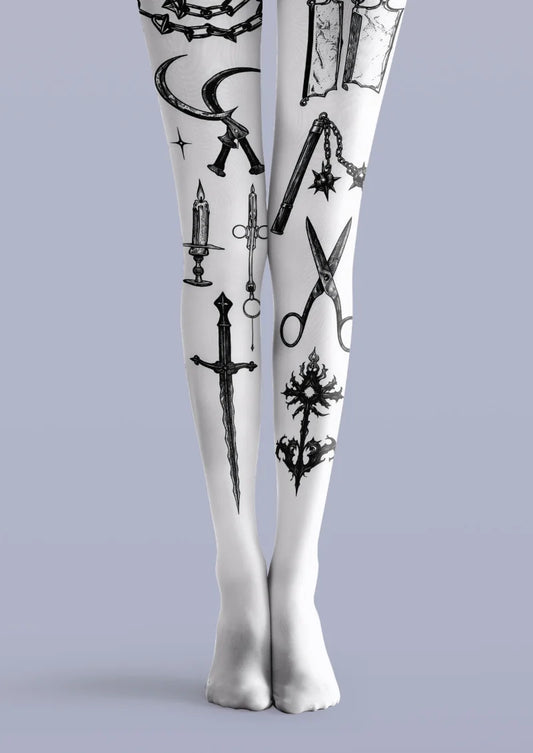 White printed tights with black tattoo-style blades, scissors, chains, candle and ornamental symbols