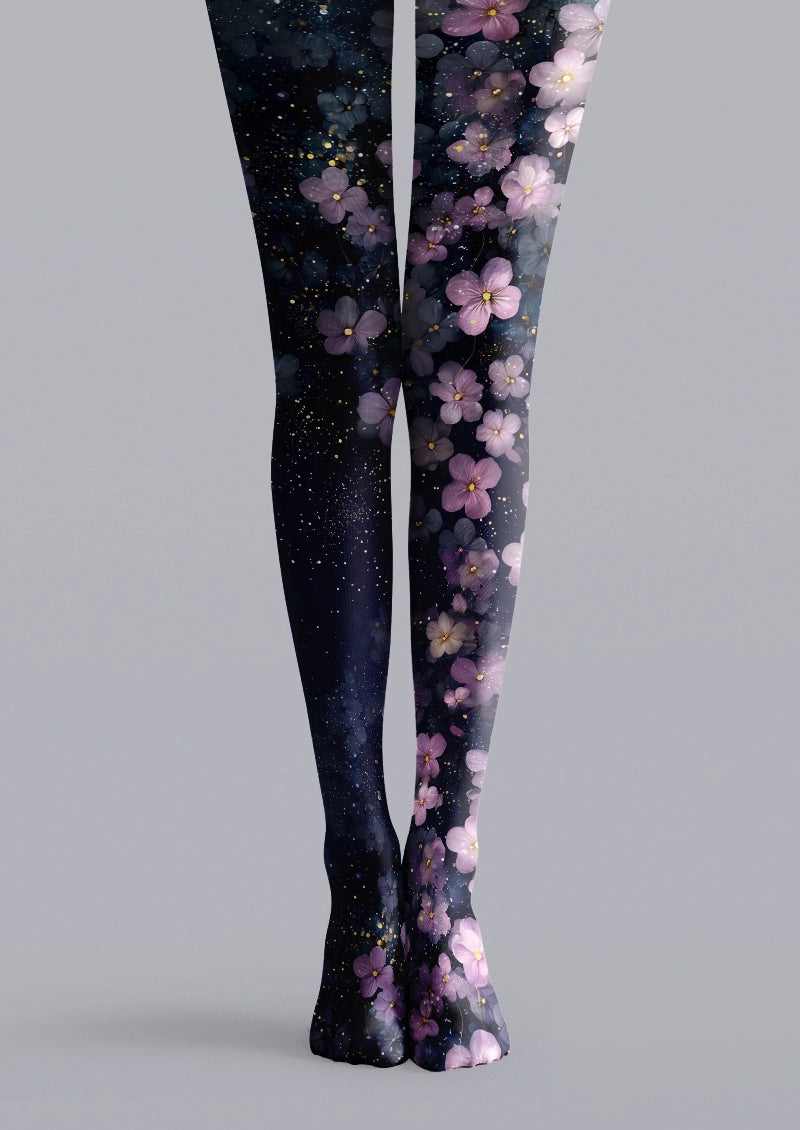 Navy printed tights with purple and pink blossoms, dark floral shading, and scattered yellow speckles
