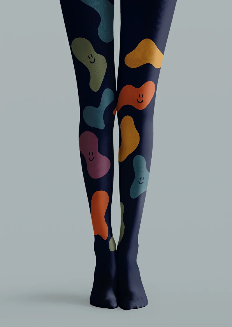Navy printed tights with colorful organic blobs and small smiling face motifs