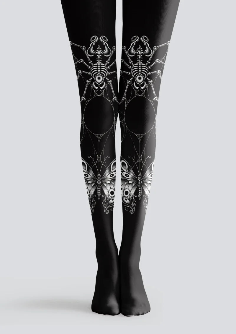 Black tights with gray and white skeletal spiders, delicate spiderwebs, large butterflies, and ornamental curls