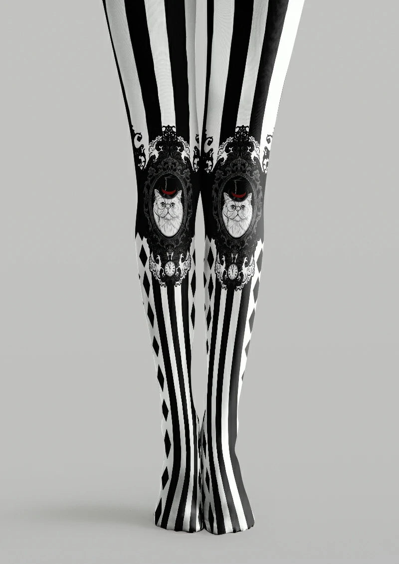 Black and white printed tights with striped panels, ornate cat portraits, clocks, and red hat accents