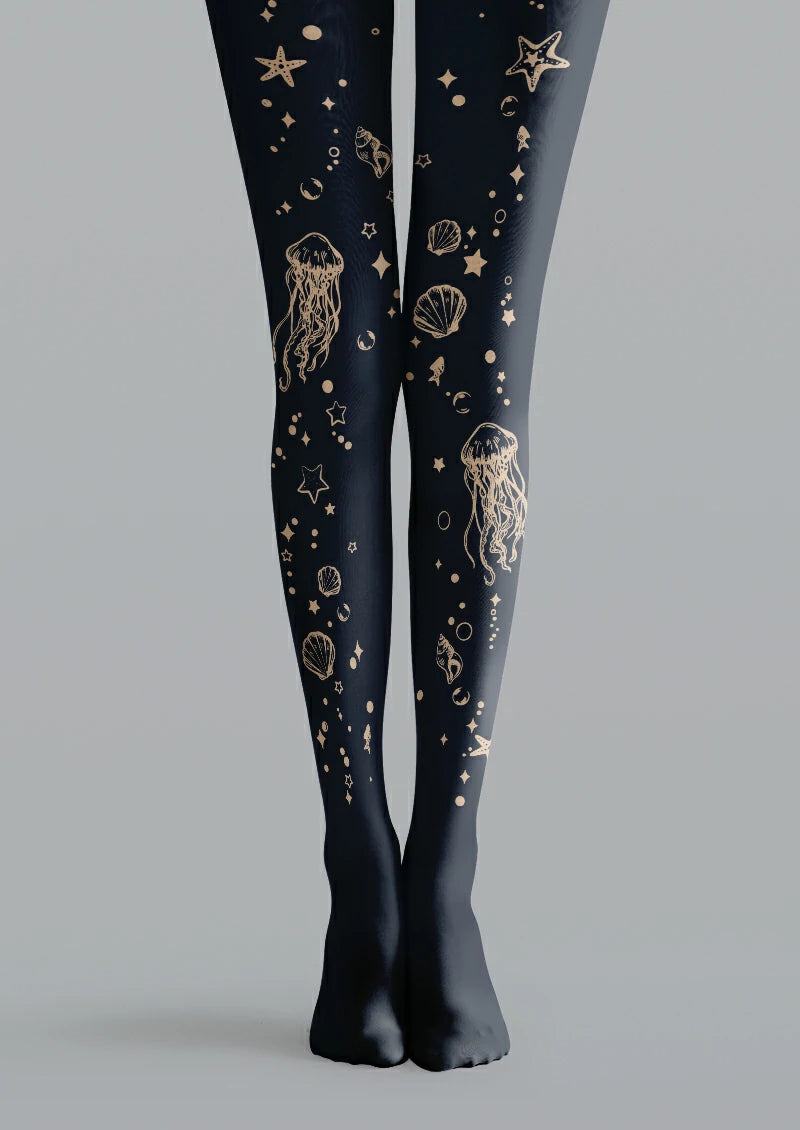 Navy printed tights with beige jellyfish, trailing tentacles, shells, starfish, circles and small decorative star shapes.