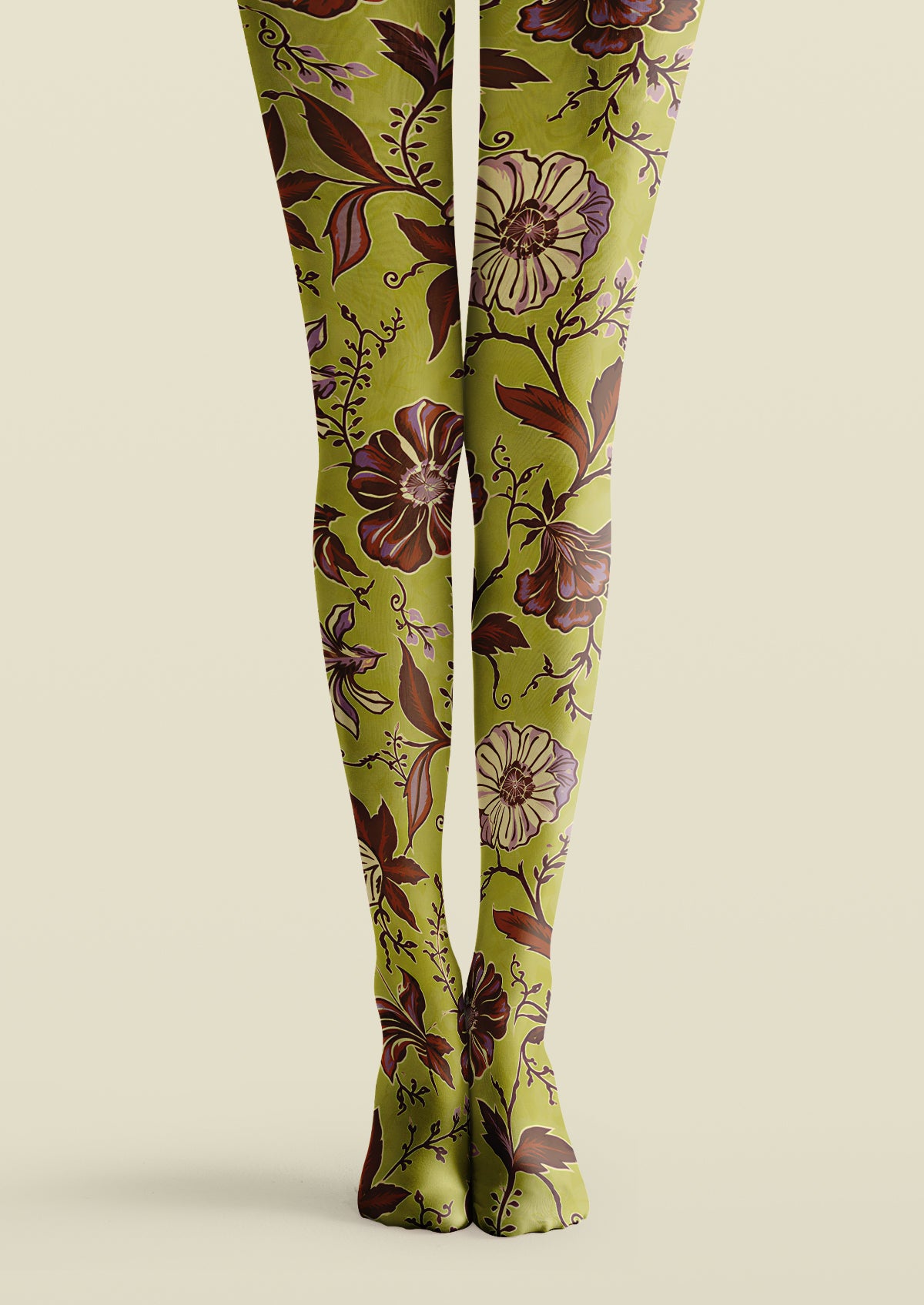 Green floral printed tights with large brown flowers, dark leafy vines, and purple botanical accents.