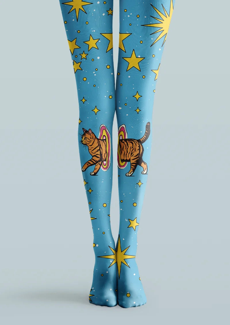 Blue printed tights with yellow stars, sunbursts, and an orange tabby cat stepping through colorful portal rings