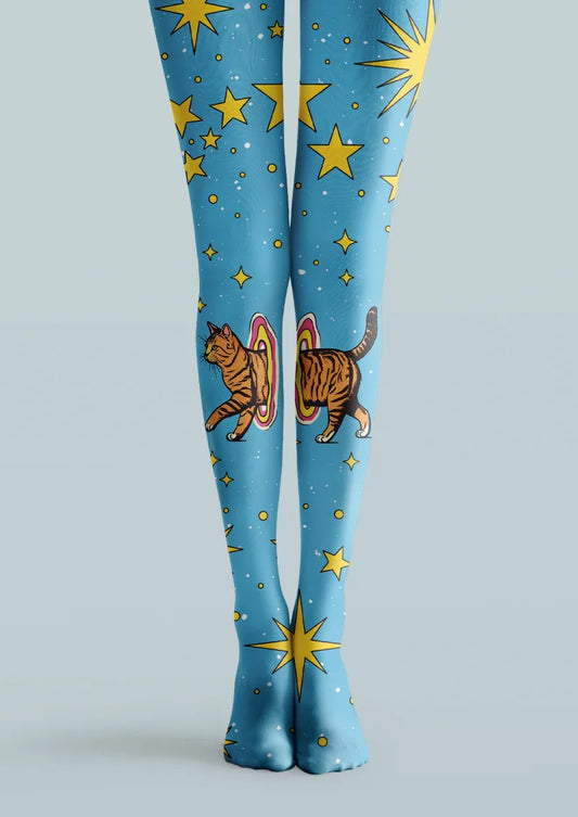 Blue printed tights with yellow stars, sunbursts, and an orange tabby cat stepping through colorful portal rings