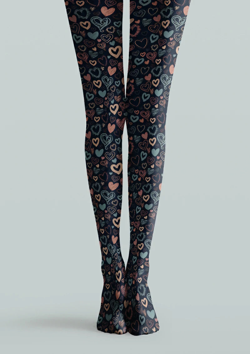 Navy printed tights with hand-drawn pink, orange, and muted green heart motifs