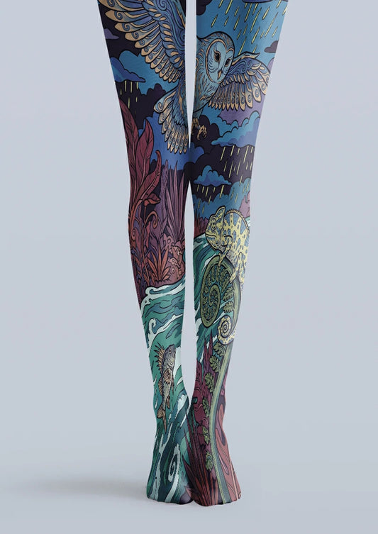 Navy printed tights with a blue owl, yellow chameleon, storm clouds, purple foliage, and turquoise waves