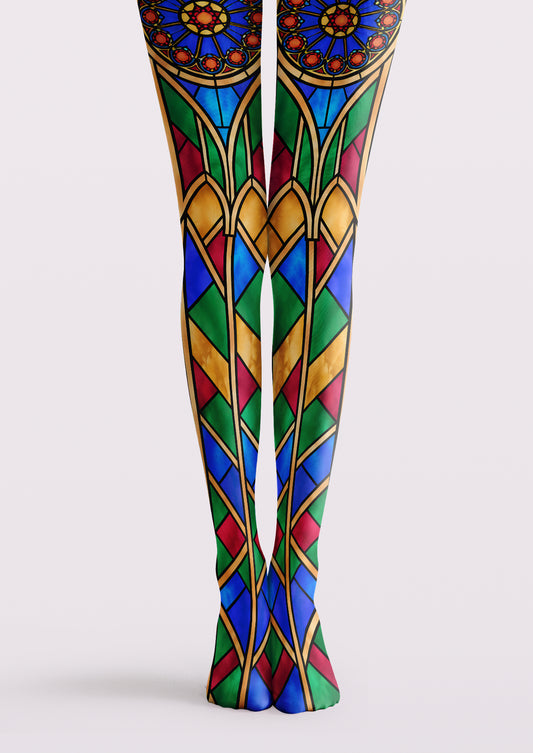 Multicolor printed tights with blue, green, red, and yellow stained glass arches, circular windows, and dark outlines.