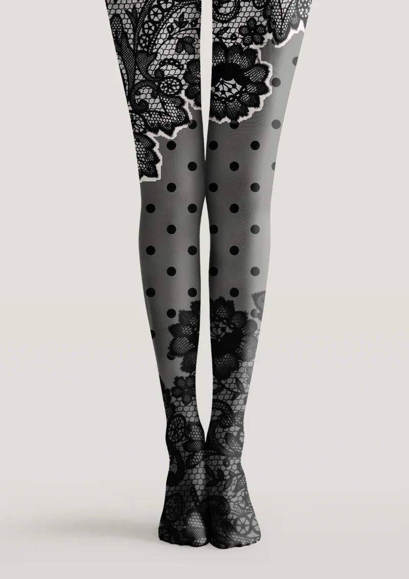 Black and gray printed tights with lace-inspired floral motifs and black polka dots across both legs
