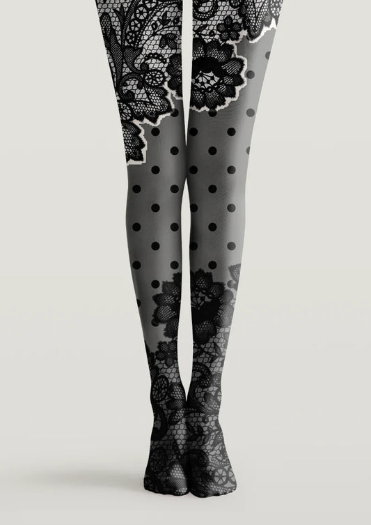 Black and gray printed tights with lace-inspired floral motifs and black polka dots across both legs