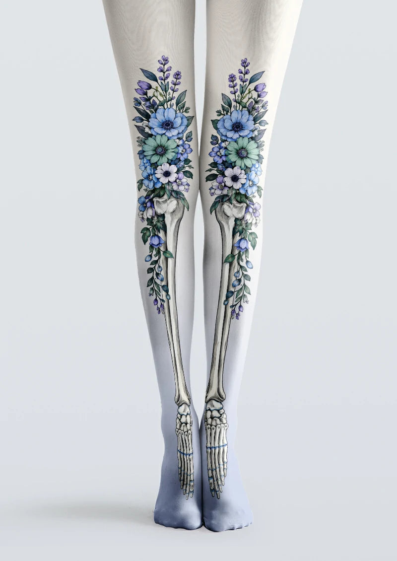White printed tights with floral bouquets and illustrated skeletal leg bones in blue and green
