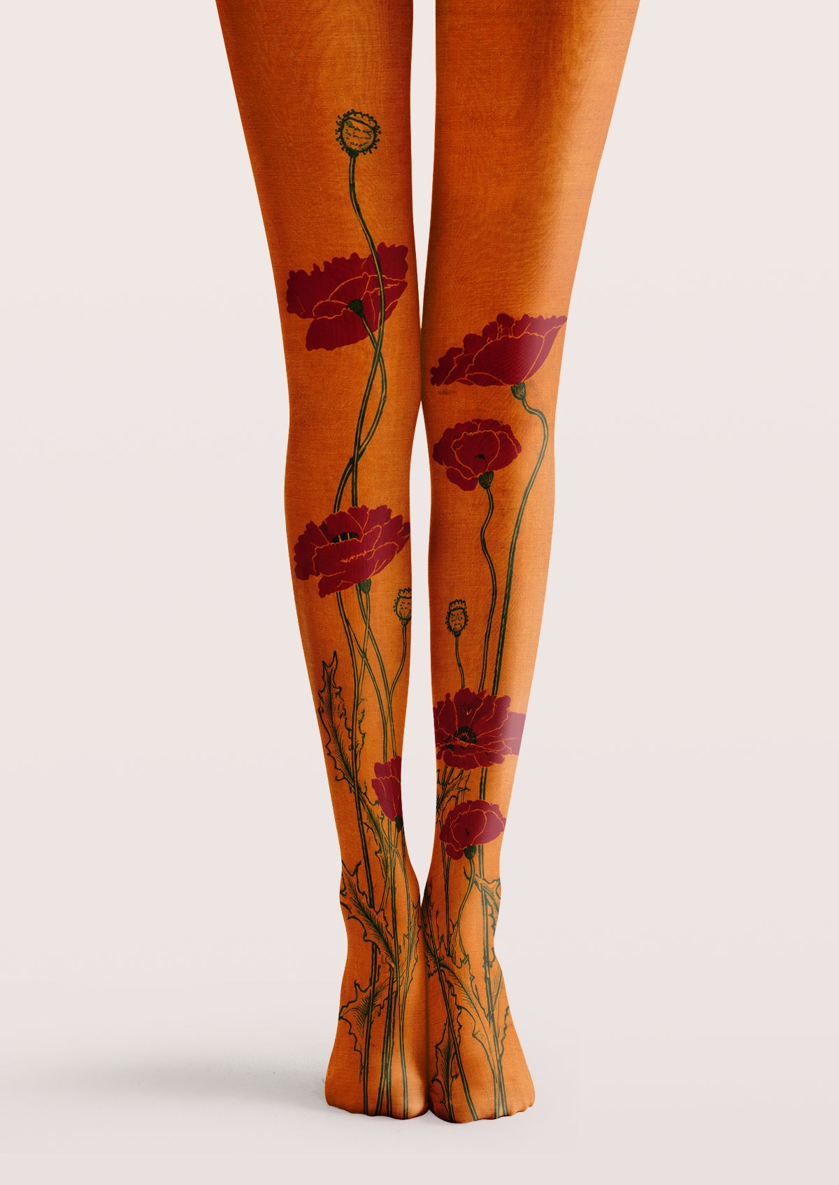 Orange printed tights with red floral motifs, green stems, and botanical patterns across both legs.