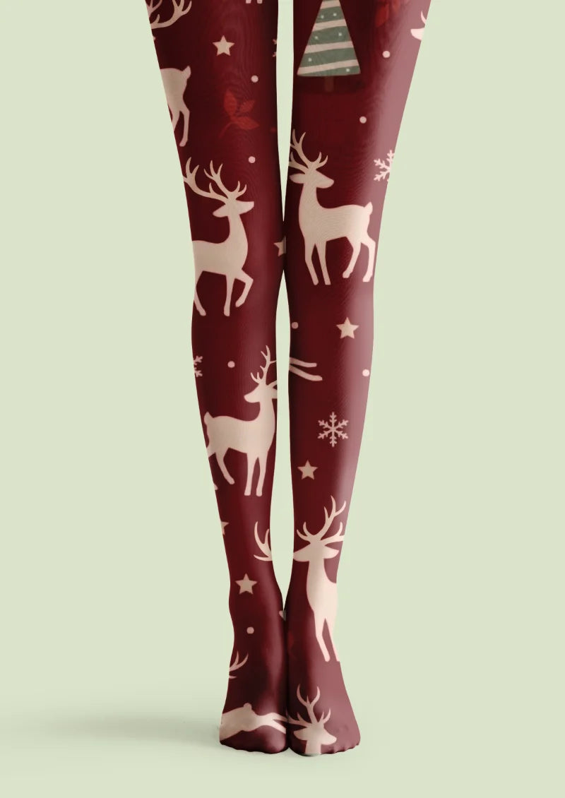 Burgundy Christmas printed tights with ivory reindeer, snowflakes, stars, dots, and green Christmas trees.
