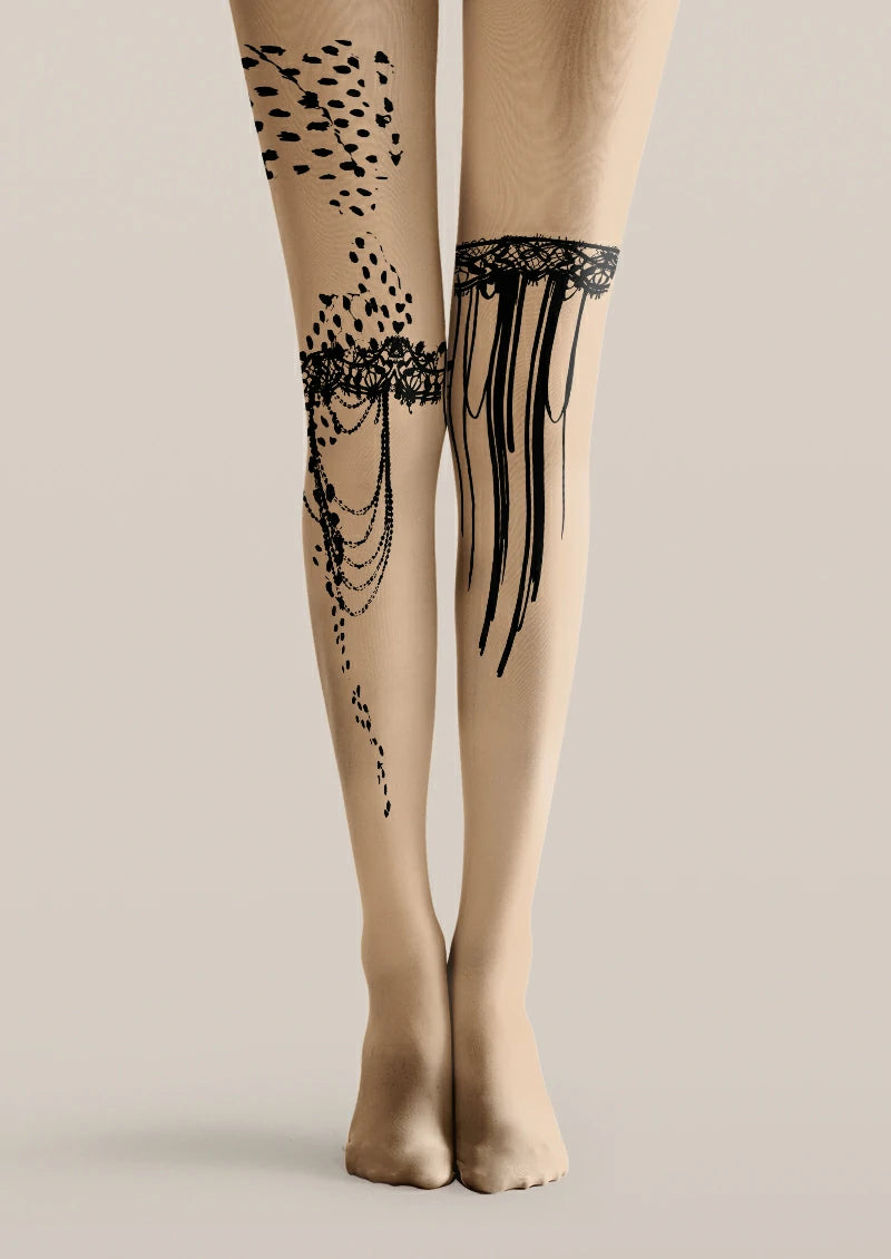 Beige printed tights with black lace-style bands, draped bead-chain motifs, irregular spots and long fringe-like lines.