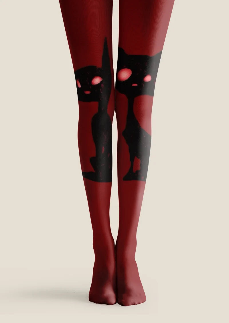 Burgundy tights with oversized black cat silhouettes and bright pink eyes