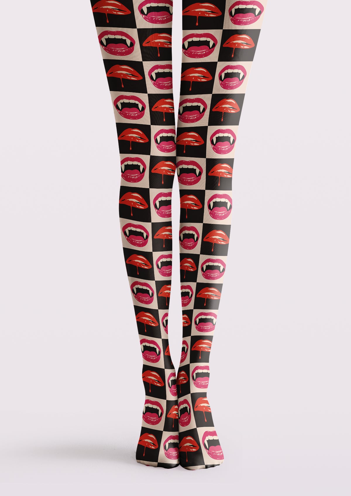 Black printed tights with red and pink lip motifs, checkerboard panels, and repeating mouth illustrations.