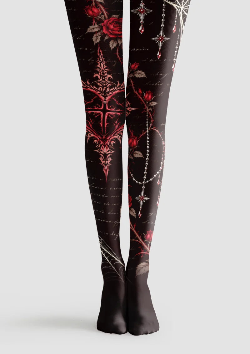 Black tights with red roses, thorned vines, pale spiderwebs, an ornate heart, printed pendant chains and cursive lettering