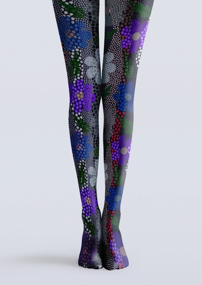 Black printed tights with purple, blue and green flowers over layered halftone dots