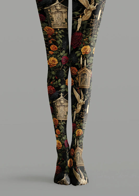 Black printed tights with roses, green leaves, bronze-toned angels, ornate buildings, cages, candles, birds and spiderwebs.
