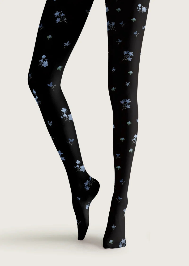 Black tights with scattered blue blossoms, small floral bouquets and muted green leaves.
