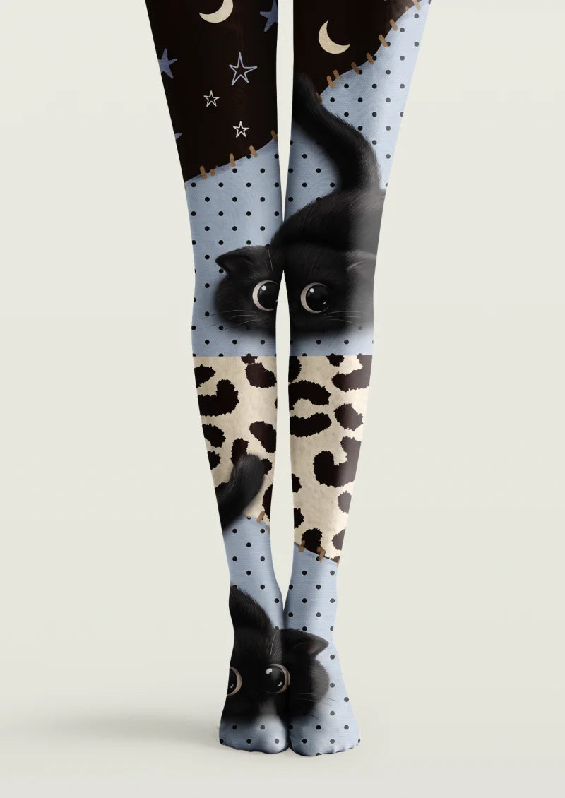 Black, blue, and ivory printed tights with cat illustrations, animal-print panels, polka dots, stars, and crescent moons