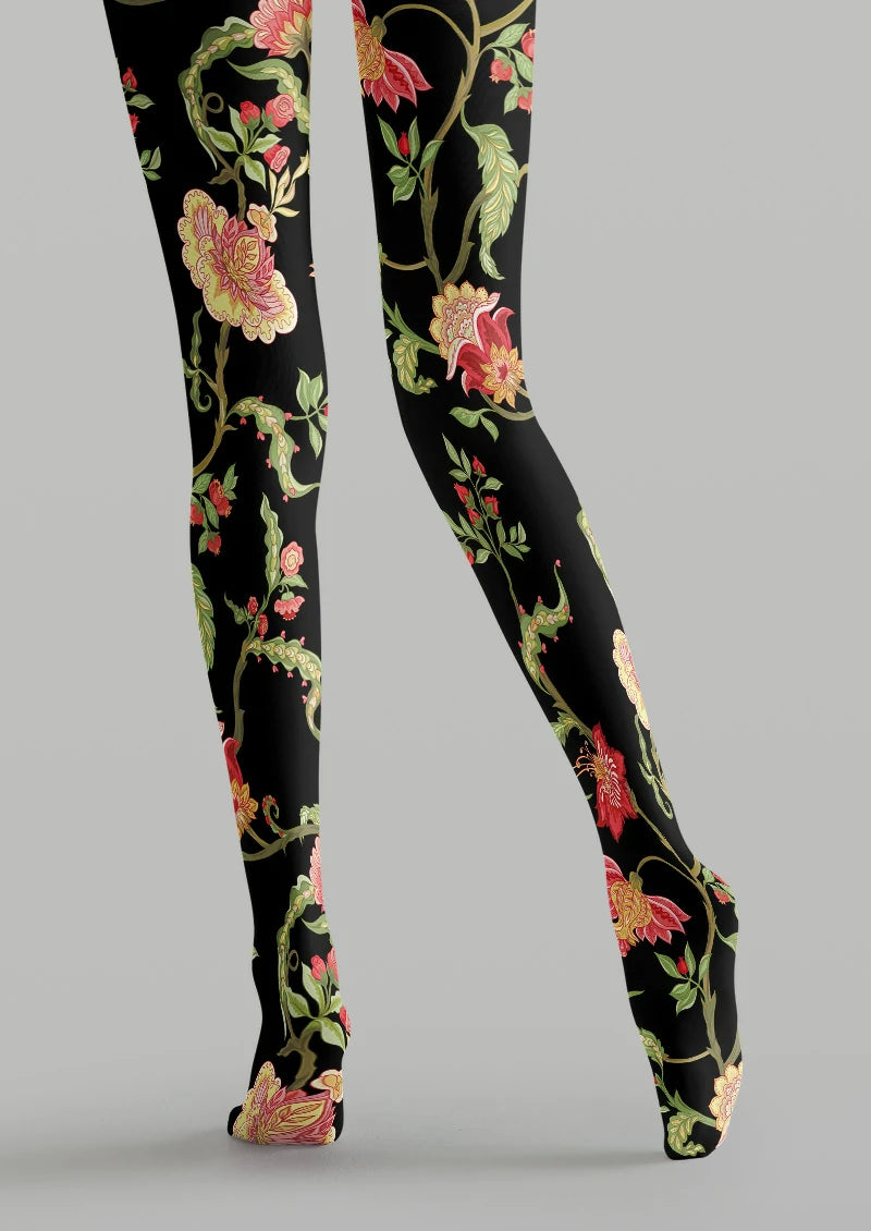 Black printed tights with sweeping green vines and layered pink and red botanical flowers