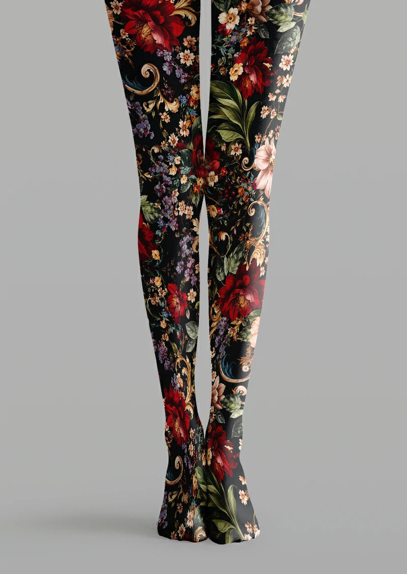 Black printed tights with large red flowers, green leaves, smaller blossoms and curling ornamental scrolls.