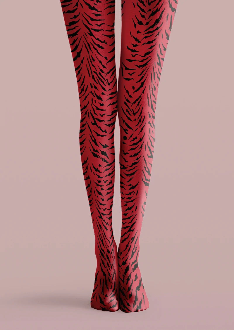 Red printed tights covered with irregular black tiger stripes in varied widths and lengths.