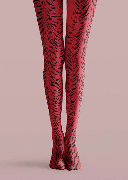 Red printed tights covered with irregular black tiger stripes in varied widths and lengths.