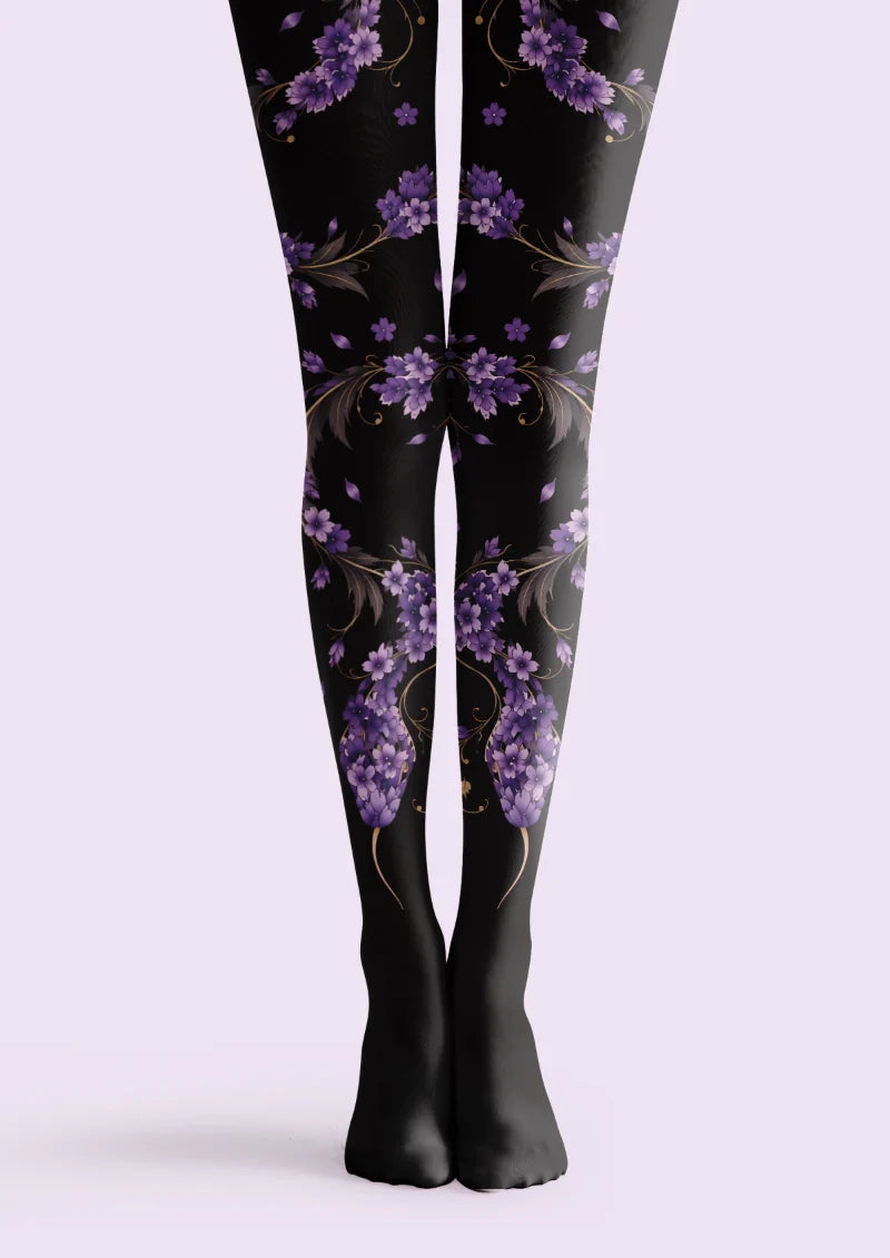 Black tights with a winding purple floral snake, a blossom-covered head, golden tendrils, and dark leaves