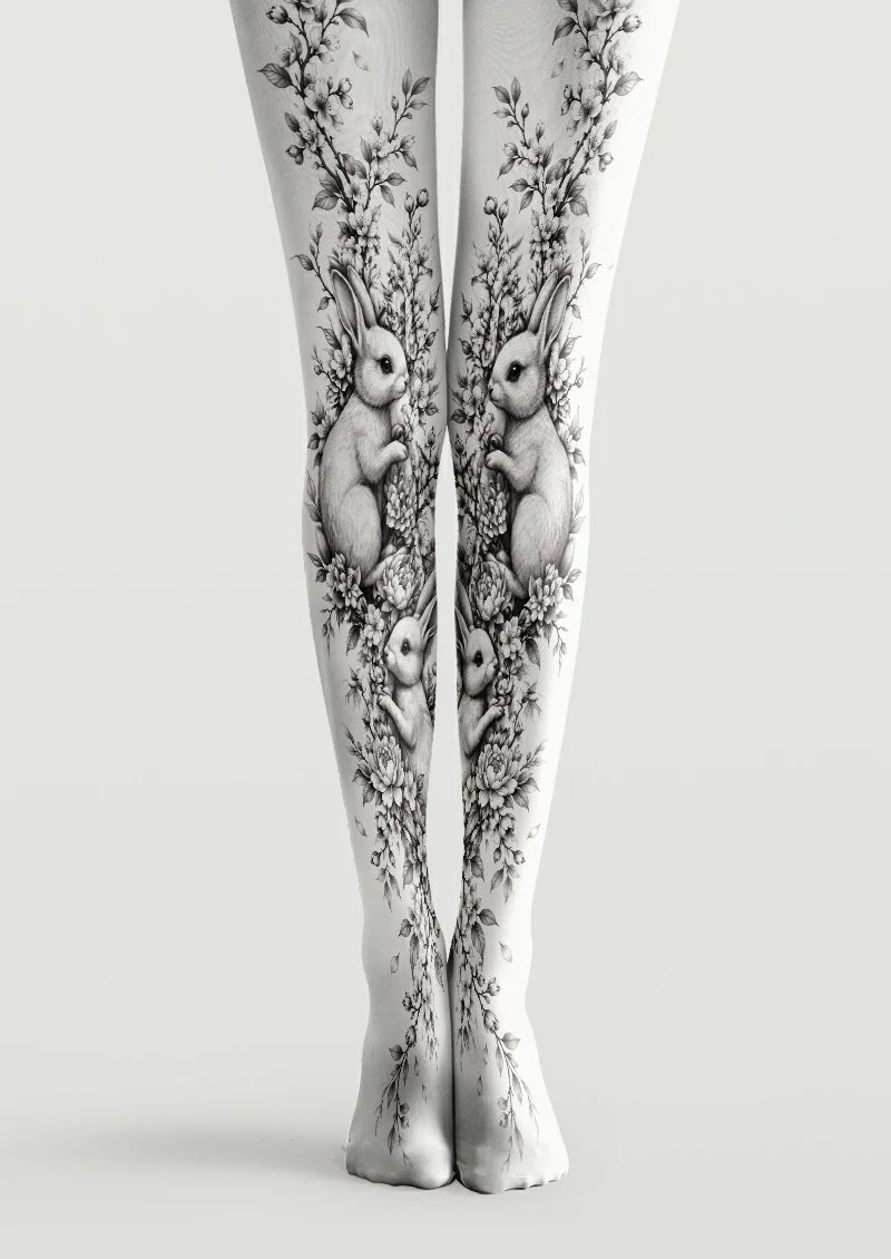 White printed tights with monochrome rabbits, flowers, leaves and trailing branches