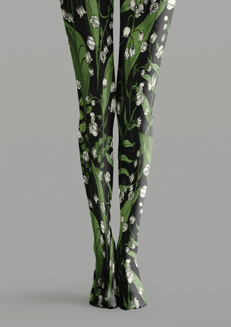 Black printed tights with white bell-shaped flowers, green stems and long leaves