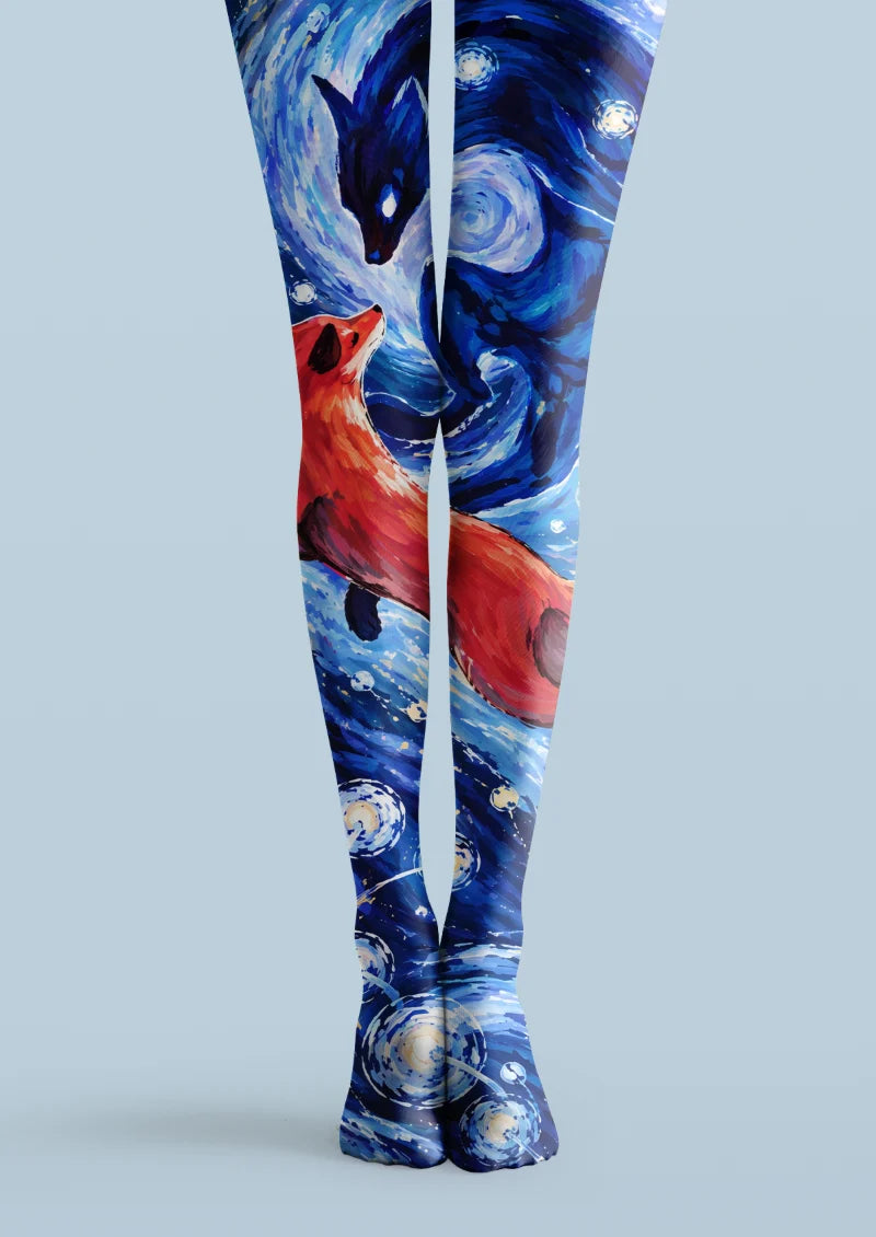 Blue printed tights with red and dark fox figures, swirling stars, and celestial artwork across both legs