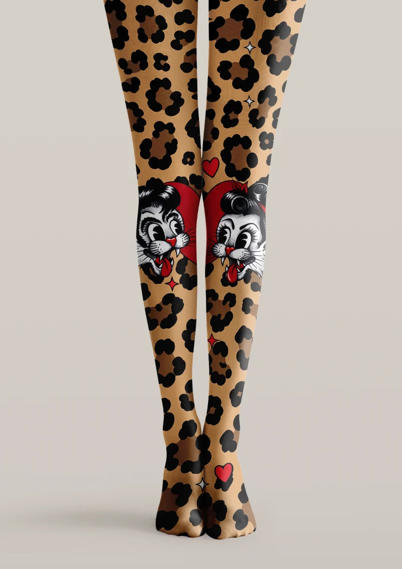 Beige printed tights with black leopard spots, red hearts, and illustrated cat faces across the knees