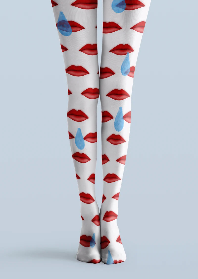 White printed tights with repeating red lip illustrations and scattered blue teardrop shapes across both legs.